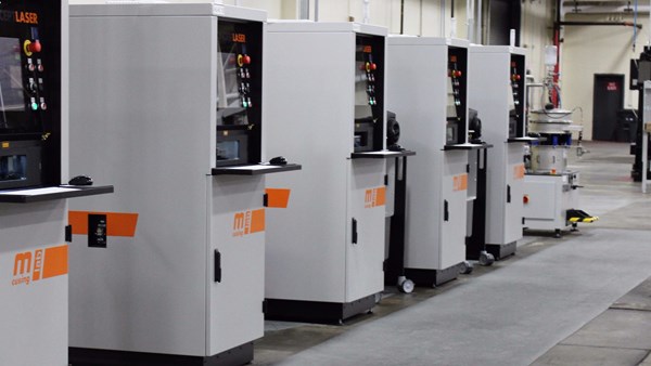 a row of powder-bed machines for additive manufacturing