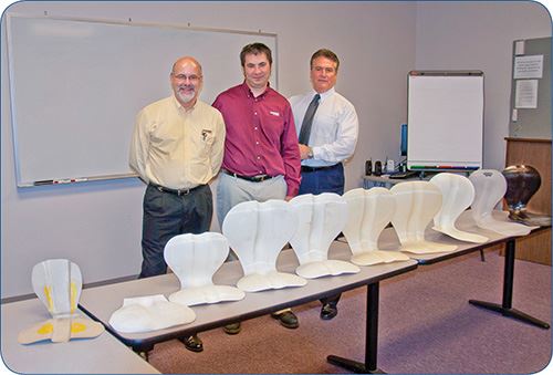 Max Leone, Larry Jedik, and Gary Kieffer of Currier Plastics with digitally printed prototypes of the PerfectSit