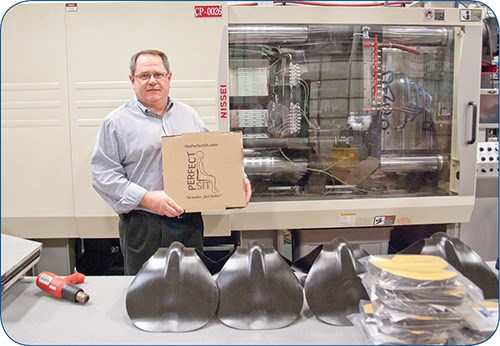 The PerfectSit is molded on a Nissei all-electric press, shown behind Currier Plastics CFO Mike Cartner