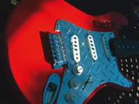 Red solid body electric guitar