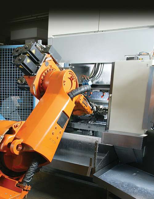 Industrial robot tending a CNC machine