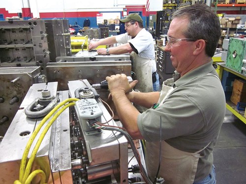 toolmakers cleaning molds