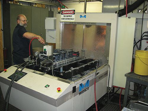 Don Donahey works on an automatic pallet changer