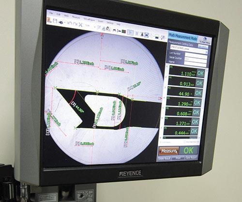 this Keyence IM series measurement system that uses a large-diameter lens and a CMOS camera to automatically measure as many as 99 points simultaneously.