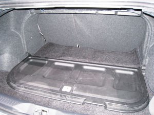 This view of the trunk divider in lowered (open) position, shows the hidden compartment and water-resistant SMC inner panel.Source: Dale Brosius