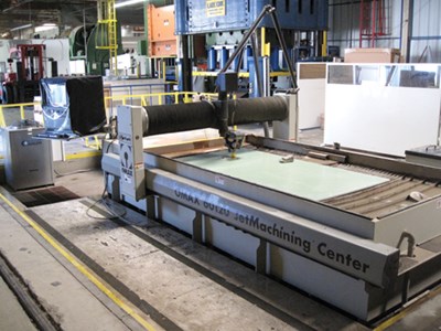 Rail car doors: Waterjet cutter shapes panels with precision