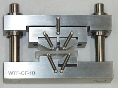 Fig. 1: A fully articulated, four-point loading flexure fixture.