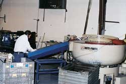 One of four vibratory finishing machines