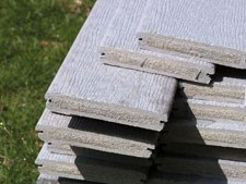 Extruded, wood-reinforced thermoplastic building material requires no paint or preservatives and is impervious to rot and insect damage.