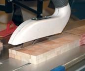 Balsa wood, sorted by density, is sawn in preparation for gluing into core sheets.