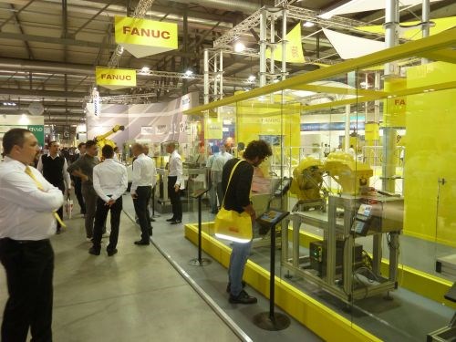 FANUC’s booth displaying robotic arms