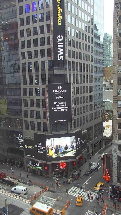 Harting greeting Obama on a screen in Times Square