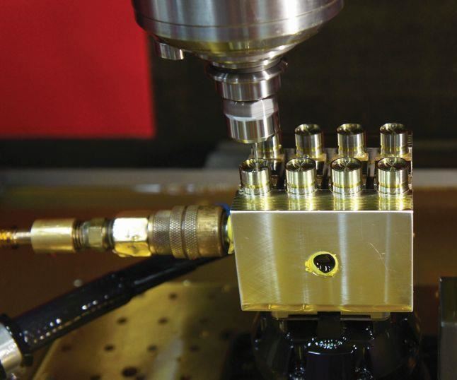 At Integral Machining LTD, inserts for expanded-beam fiber-optic cable connectors undergo milling on a Kern Evo machining center. 