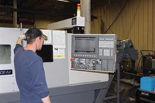 an operator monitors spindle load