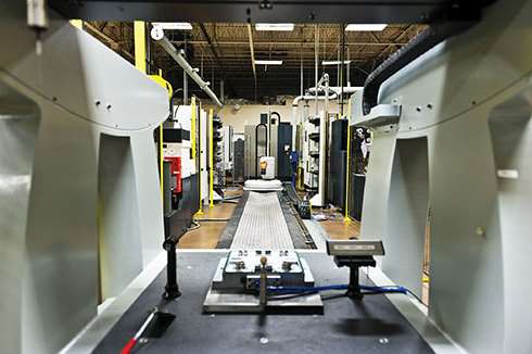 Brown & Sharpe One CMM looks over 3R Workmaster Linear automation solution