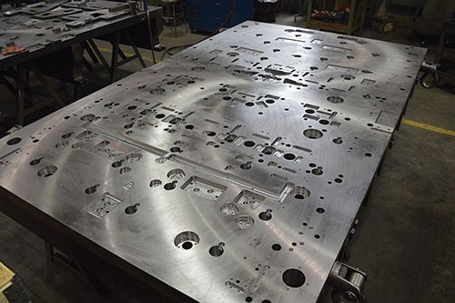 This lower die plate is made of hot rolled steel and measures 3.5 by 72.0 by 120.0 inches. 
