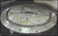Multiple workpieces are processed at a time using discs 