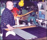 Operator Mike Rushnok monitors steering rack blanks