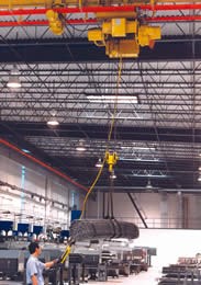 Overhead cranes and storage racks with roll-out shelves 