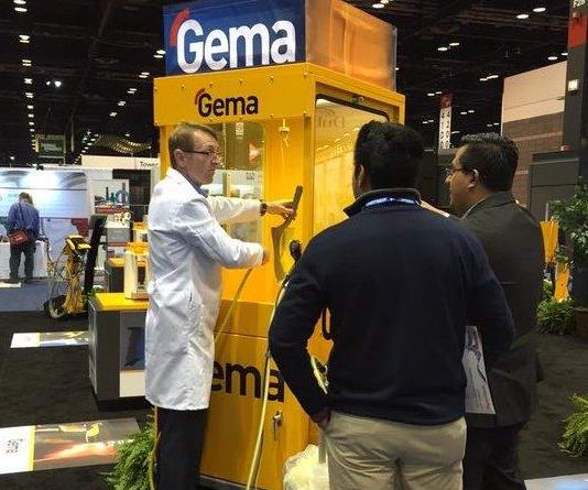 Jeff Hale instructs visitors about Gema products at a recent trade show.