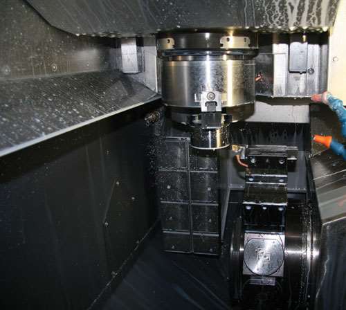This EMCO vertical turning center provides quick loading through the spindle’s direct pick up of the raw material.