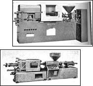 Two of the first reciprocating-screw machines