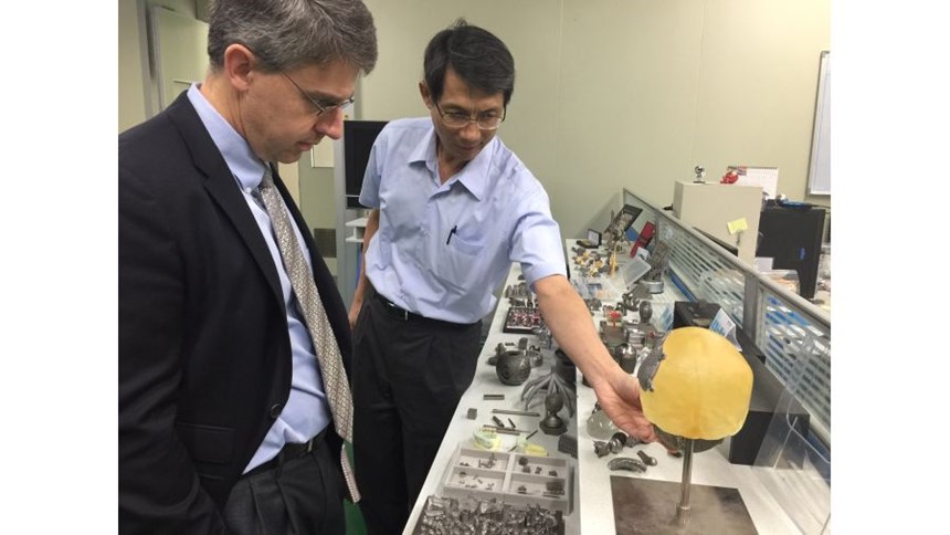 Dr. Horng shows me various parts produced on the powder-bed machine.
