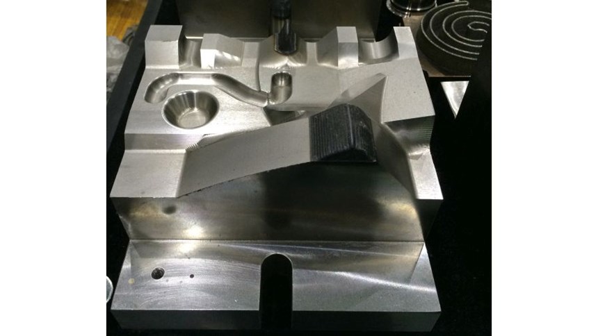 Repair is a likely application of the metal deposition machine. This part, photographed at Tongtai, simulates repair of a mold or die.