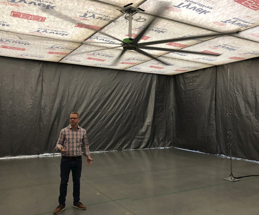 Jay Fizer, R&D Manager, Big Ass Fans, under fan in the smaller chamber