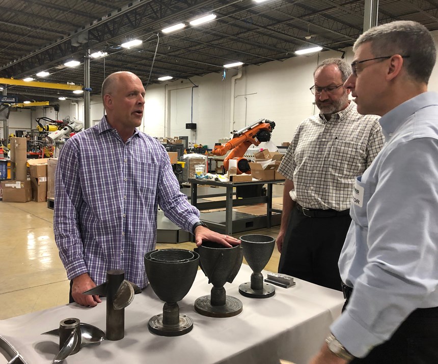 Addere president Scott Woida discusses sample parts made using the robot AM system