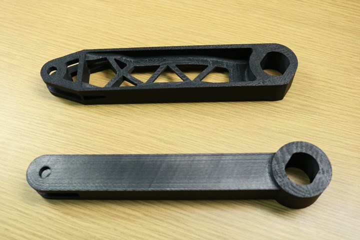 3d printed ABS versions of the original and topology optimized torque arm