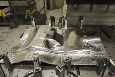 A photo showing a Lincoln Electric Additive Solutions-made facesheet, a complicated, asymmetrical tool for aerospace composites
