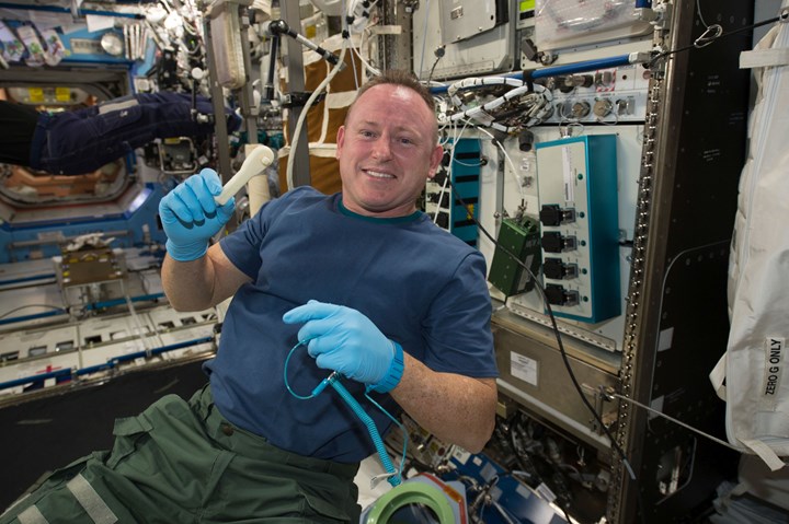 astronaut with a 3d printed ratchet wrench