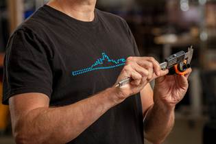 measuring a 3D-printed part with calipers