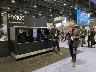Ross Adams and Christian Lönne speaking in front of the PX100 in the Markforged booth