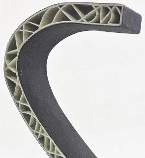 close up of moi composites 3D printed continuous glass fiber core structure laminated with carbon fiber epoxy composite