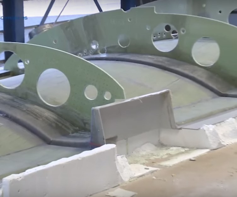 VABO Composites bonding composite ribs to yacht mast shell