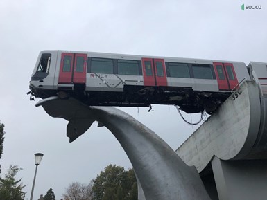 composite whale statue catches runaway train car