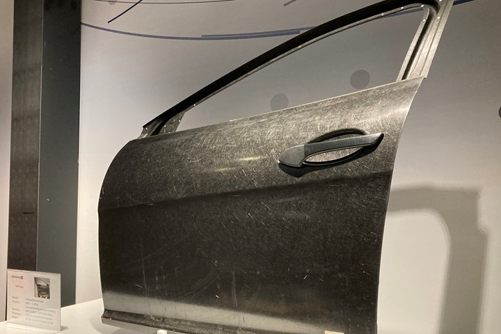 Carbon fiber-reinforced thermoplastic automotive door panel prototype developed by Aimplas.