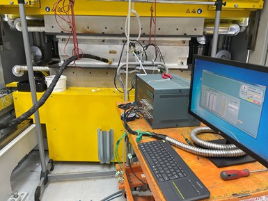 experimental setup at Meggitt using linear dielectric sensor in RTM press