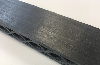 AFP continuous carbon fiber skin placed onto 3D printed composite core