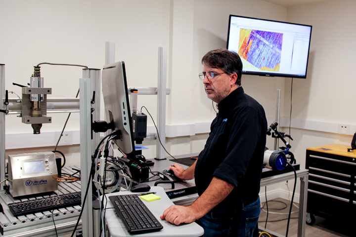 John Cabrer, senior systems engineer, conducting a feasibility study in the MoviTHERM NDT lab. 