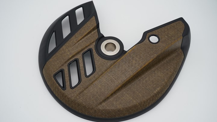 Bcomp and KTM natural fiber composite brake disc cover with Conexus technology