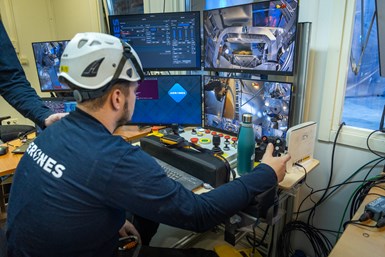 Technicians view real-time feedback from Aerones robotic system.