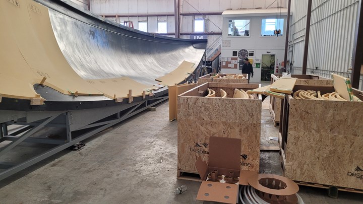 beSpline shaped foam kits being applied to laminate in boat hull mold