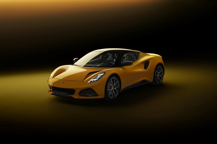 Front view of a yellow Lotus Emira sports car.