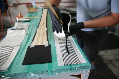 layup of composite skis with graphene enhancement