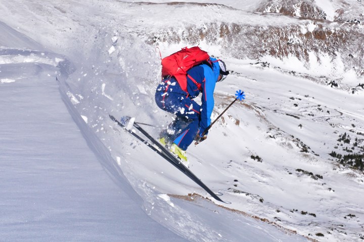skier with carbon fiber composite skis enhanced with graphene