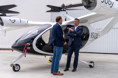 California Governor Gavin Newsom (right) and JoeBen Bevirt, Joby Aviation’s founder and CEO (left), standing in front of the aircraft.