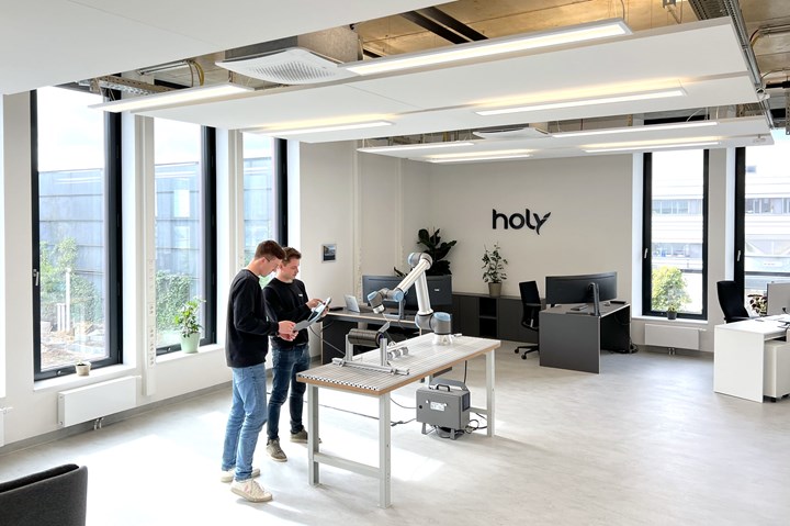 Holy Technologies personnel working in the office.